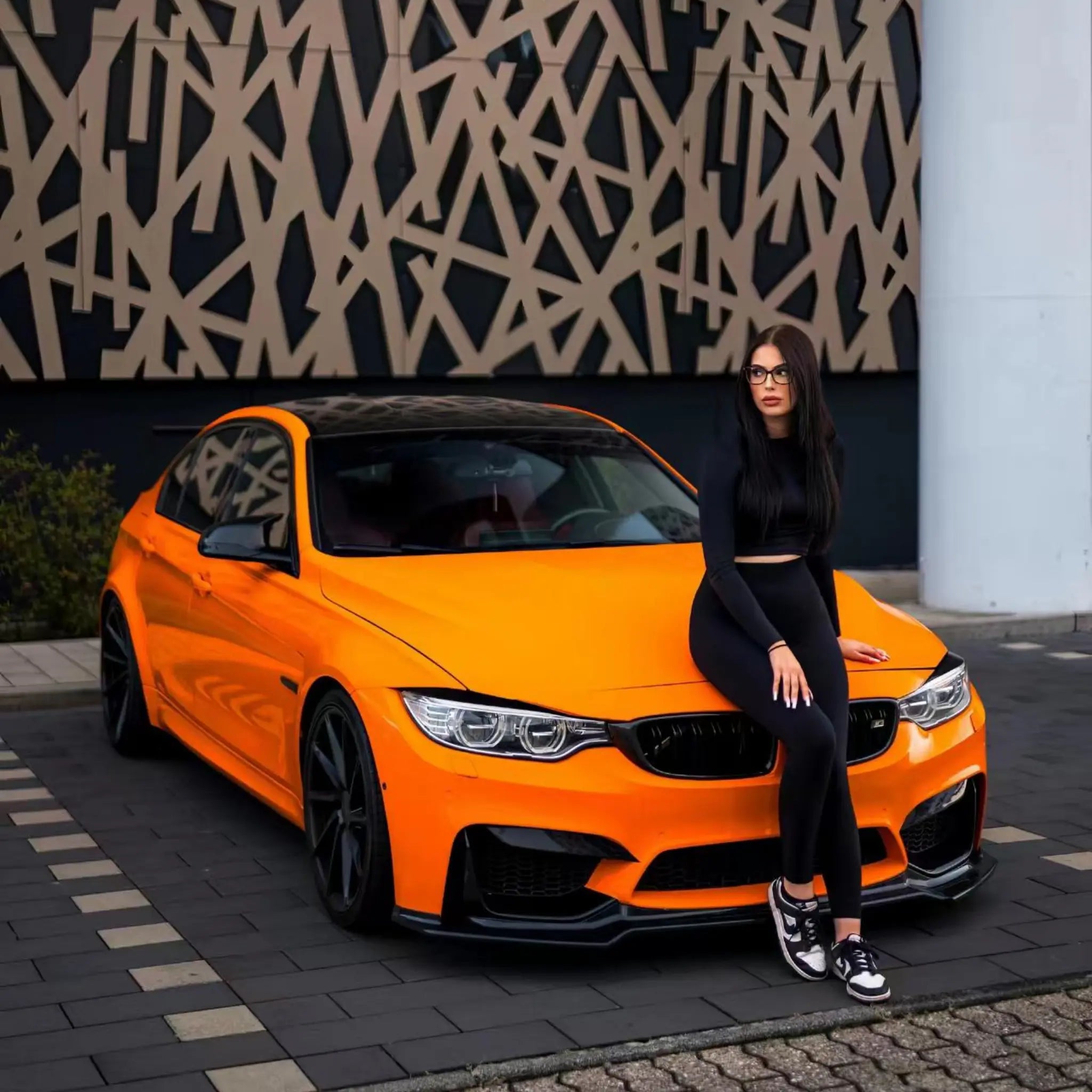 Modified BMW M3 (F80) sedan in Gloss Hermès Orange vinyl - front-right angle - Kaleido