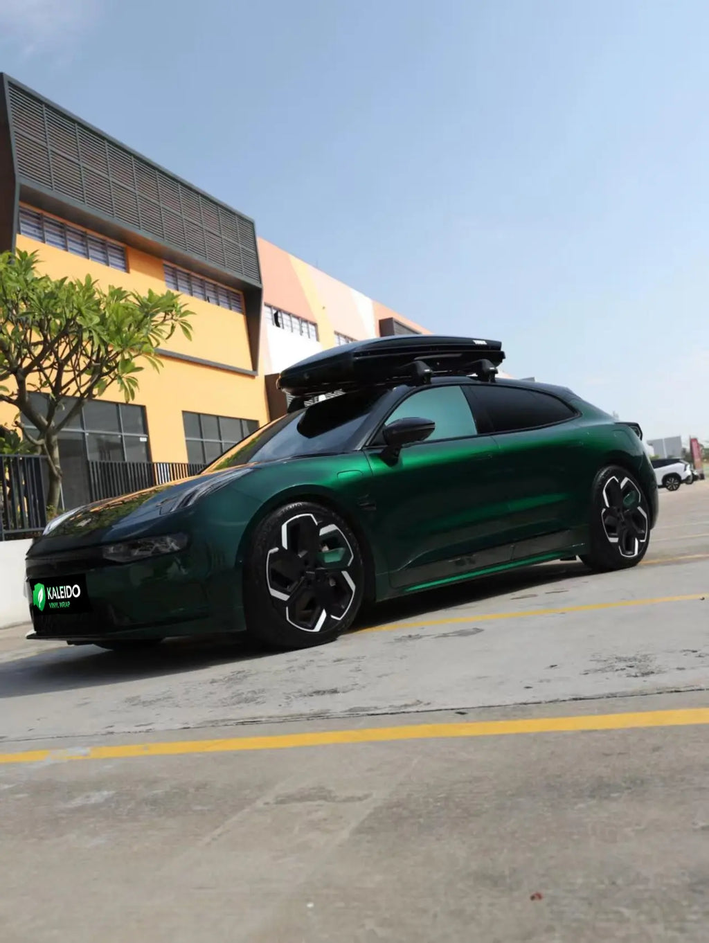 Gloss Metallic Agate Green wrap on Zeekr 001 - front-left angle with gemstone-like green depth - Kaleido