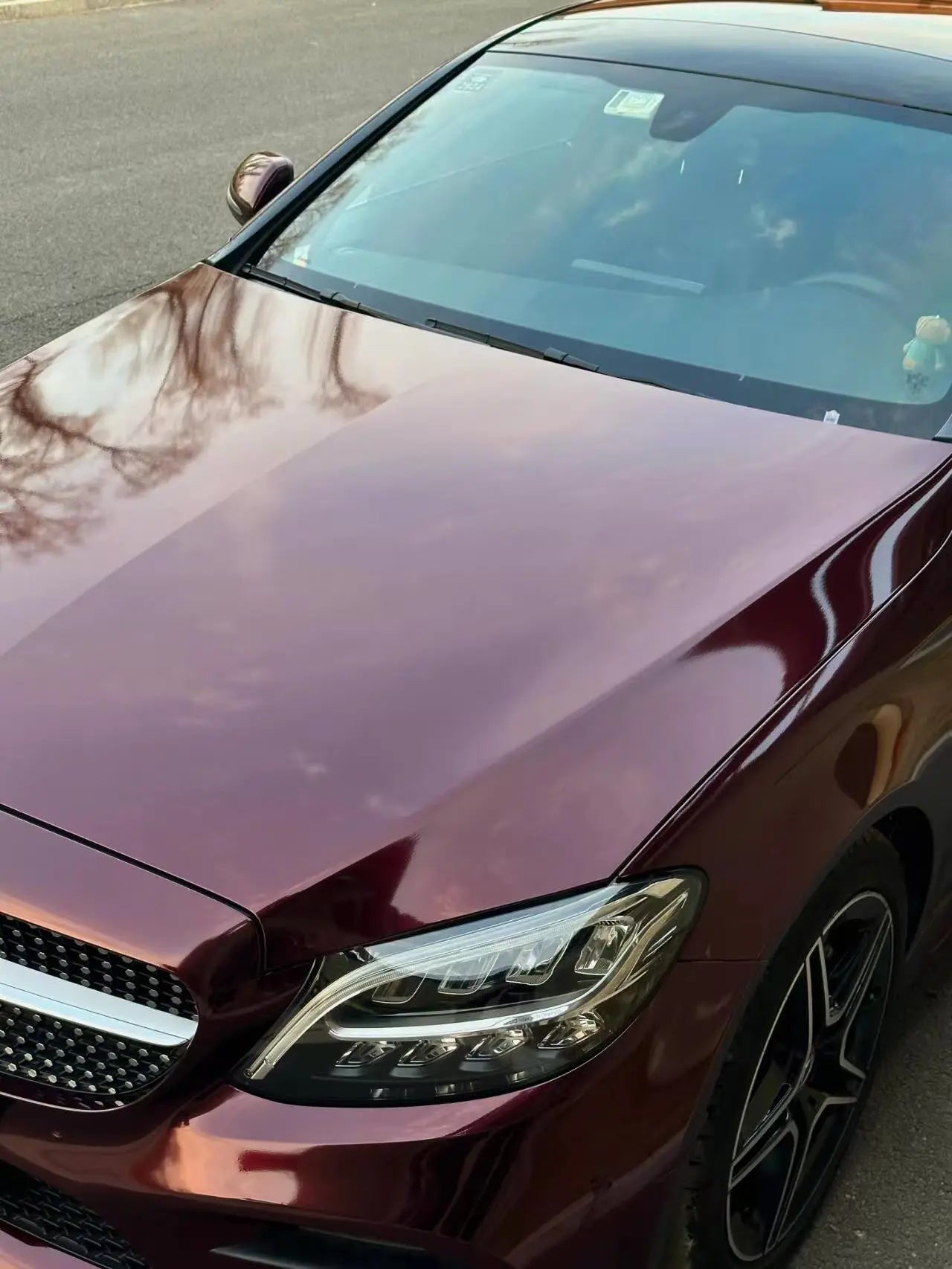 Gloss Metallic Black Rose wrap on Mercedes C-Class Coupe front-left hood area - Kaleido