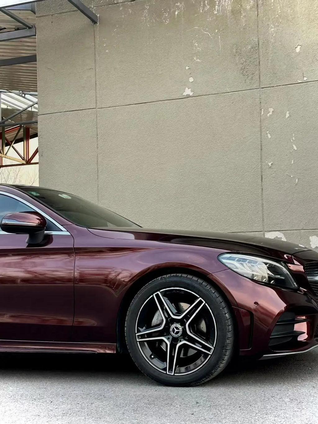 Close-up front-right detail of Gloss Metallic Black Rose wrap on Mercedes C-Class Coupe - Kaleido