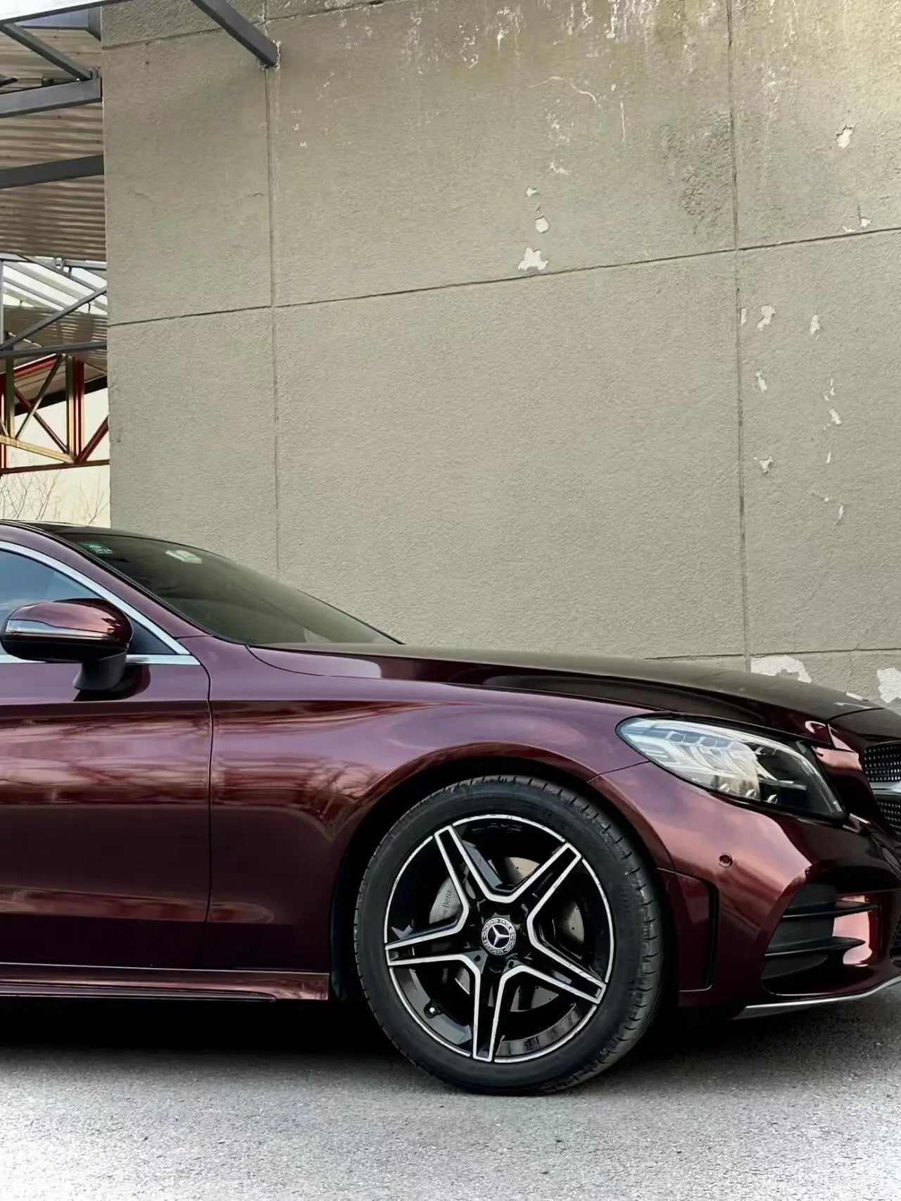 Close-up front-right detail of Gloss Metallic Black Rose wrap on Mercedes C-Class Coupe - Kaleido