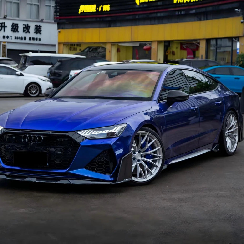 Front view of Audi RS7 in Deep Blueberry Metallic - showcasing signature grille and headlights - Kaleido