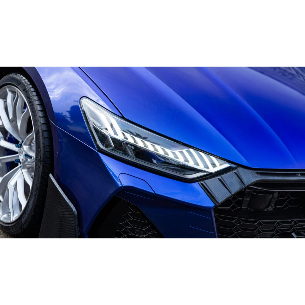 Close-up of Deep Blueberry Metallic wrap on Audi RS7 - headlight and front wheel arch detail - Kaleido
