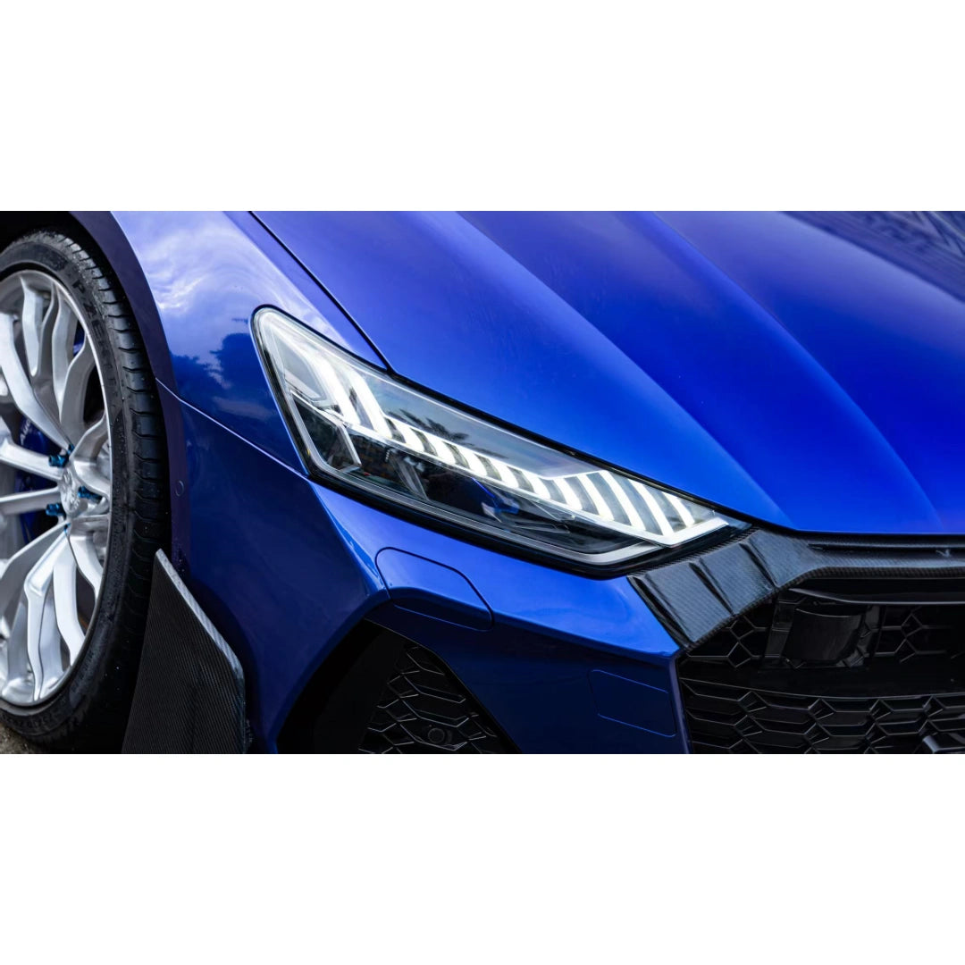 Close-up of Deep Blueberry Metallic wrap on Audi RS7 - headlight and front wheel arch detail - Kaleido