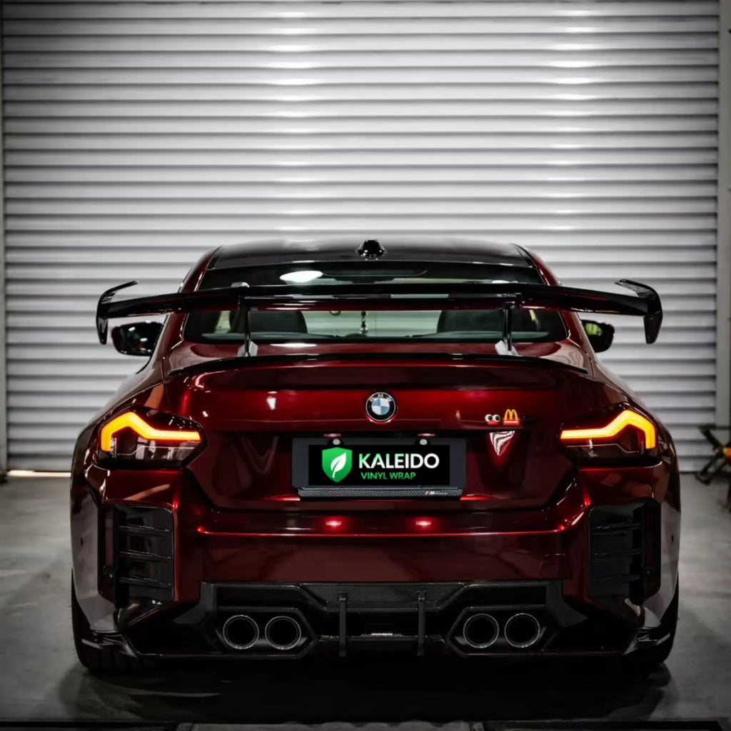 Rear view of BMW M2 in Gloss Metallic Dragon Blood vinyl wrap - Kaleido