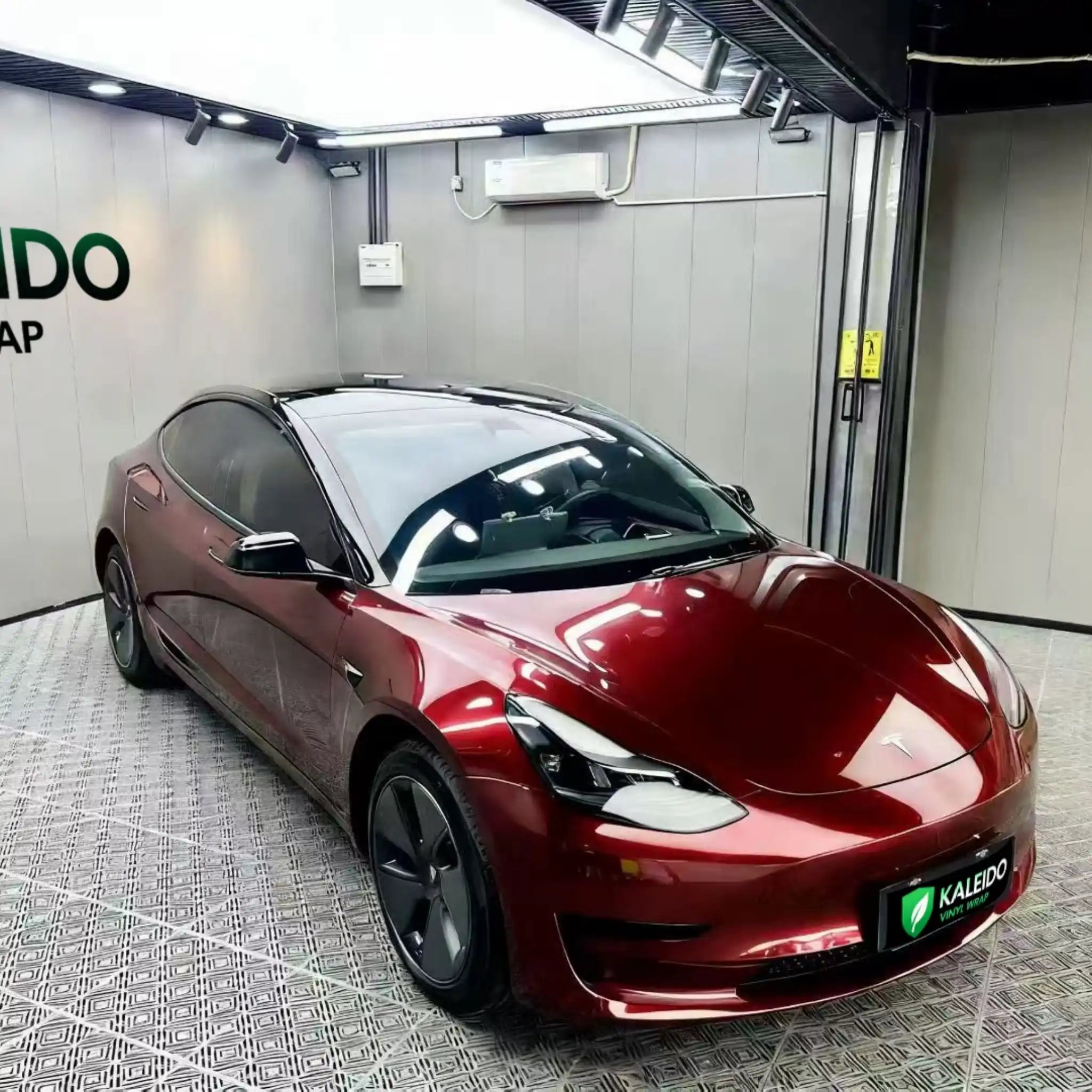 Gloss Metallic Dragon Blood wrap on Tesla Model 3 - front-right angle - Kaleido