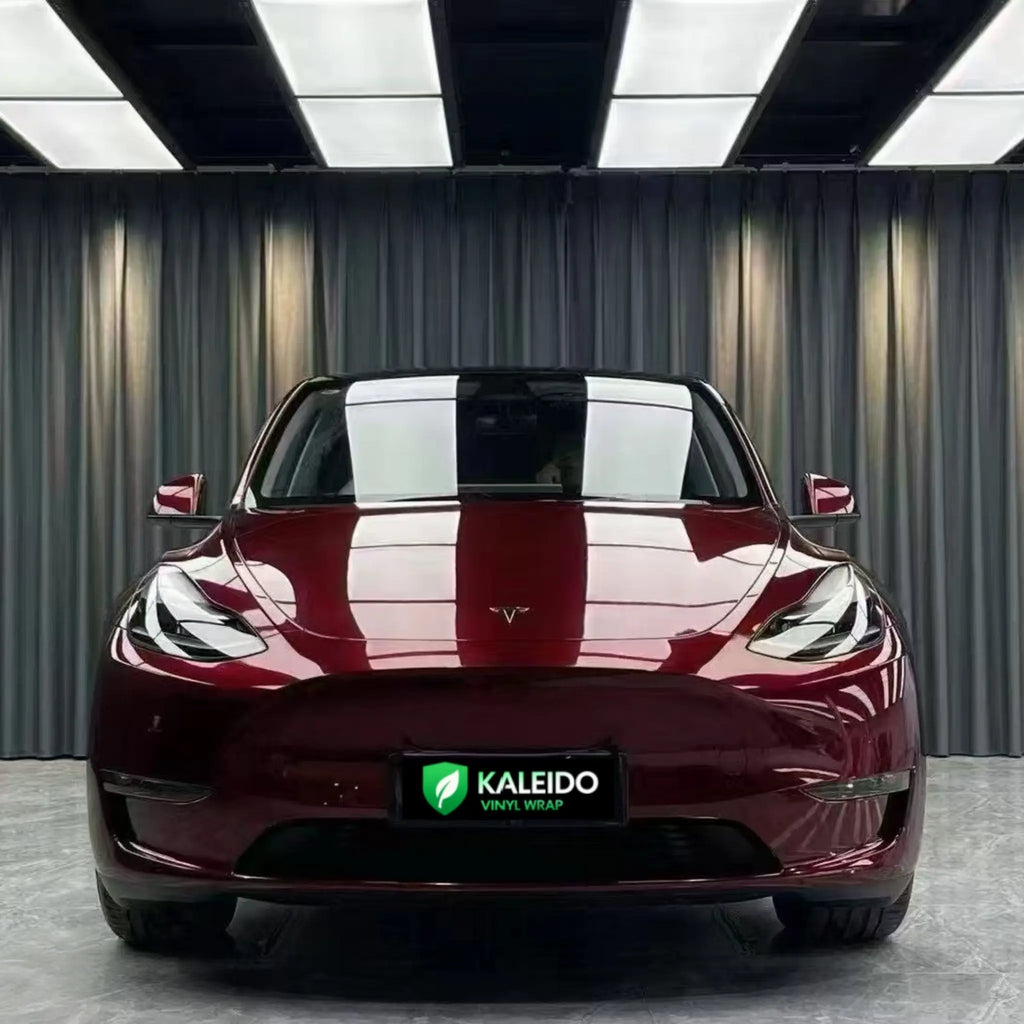 Front view of Tesla Model Y in Gloss Metallic Dragon Blood vinyl - deep red metallic finish - Kaleido