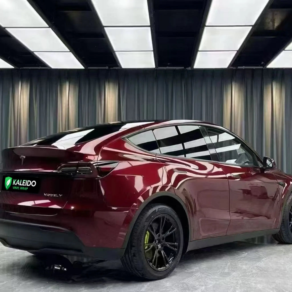 Tesla Model Y in Gloss Metallic Dragon Blood wrap - rear-right view of SUV - Kaleido