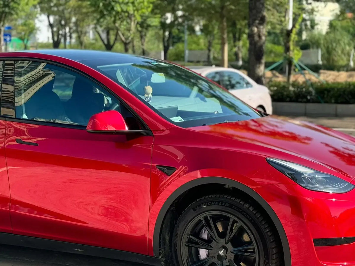 Tesla Model Y with Gem Red gloss film - front-quarter right view highlighting metallic sparkle - Kaleido