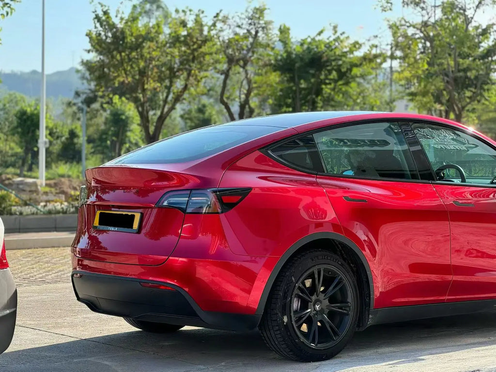 Tesla Model Y in Gem Red metallic wrap - rear-quarter right view - Kaleido