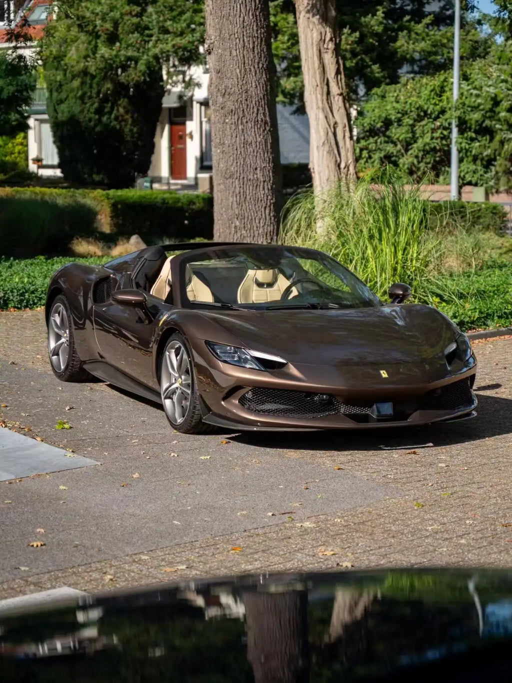 Ferrari 296 GTS in Mocha Truffle gloss metallic - front-right view with retractable hardtop - Kaleido