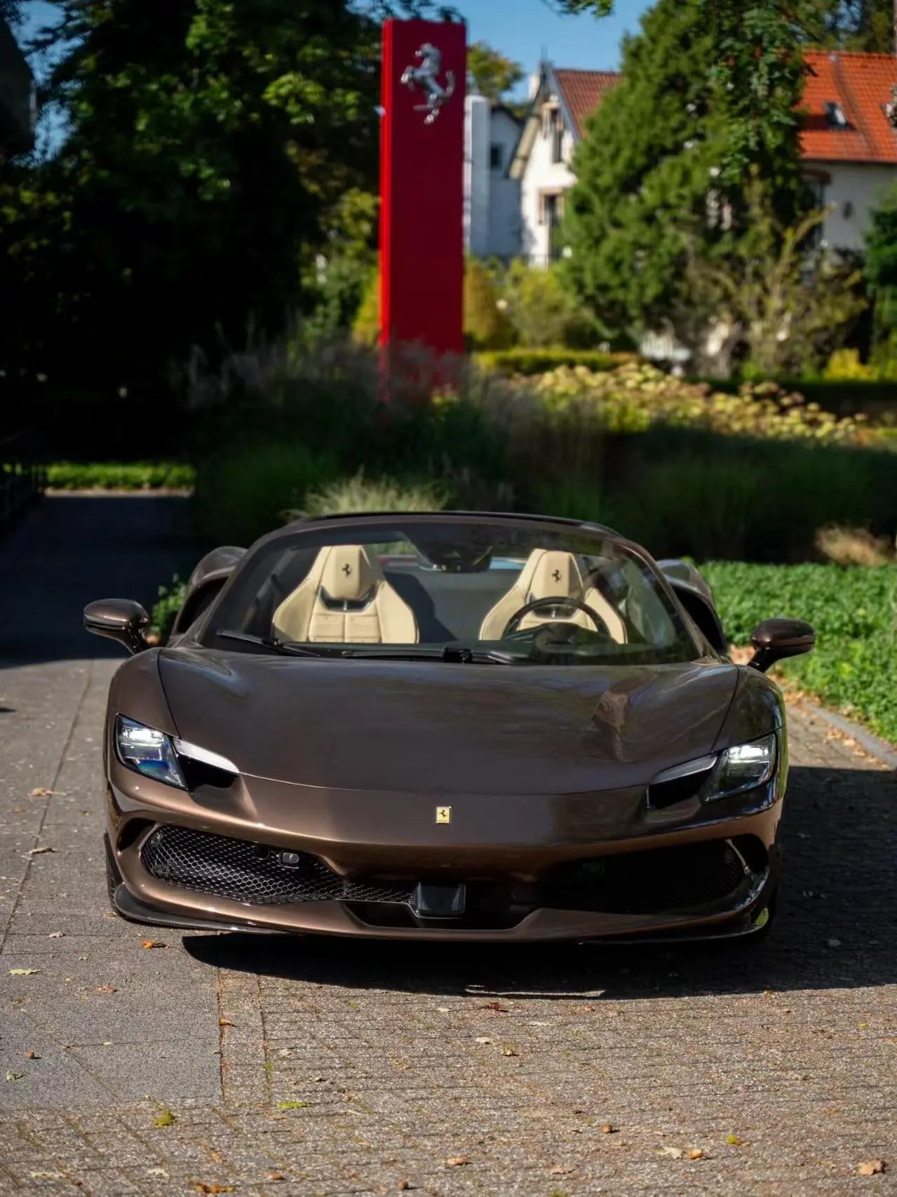 Front view of Mocha Truffle wrapped Ferrari 296 GTS - showcasing iconic Ferrari styling - Kaleido