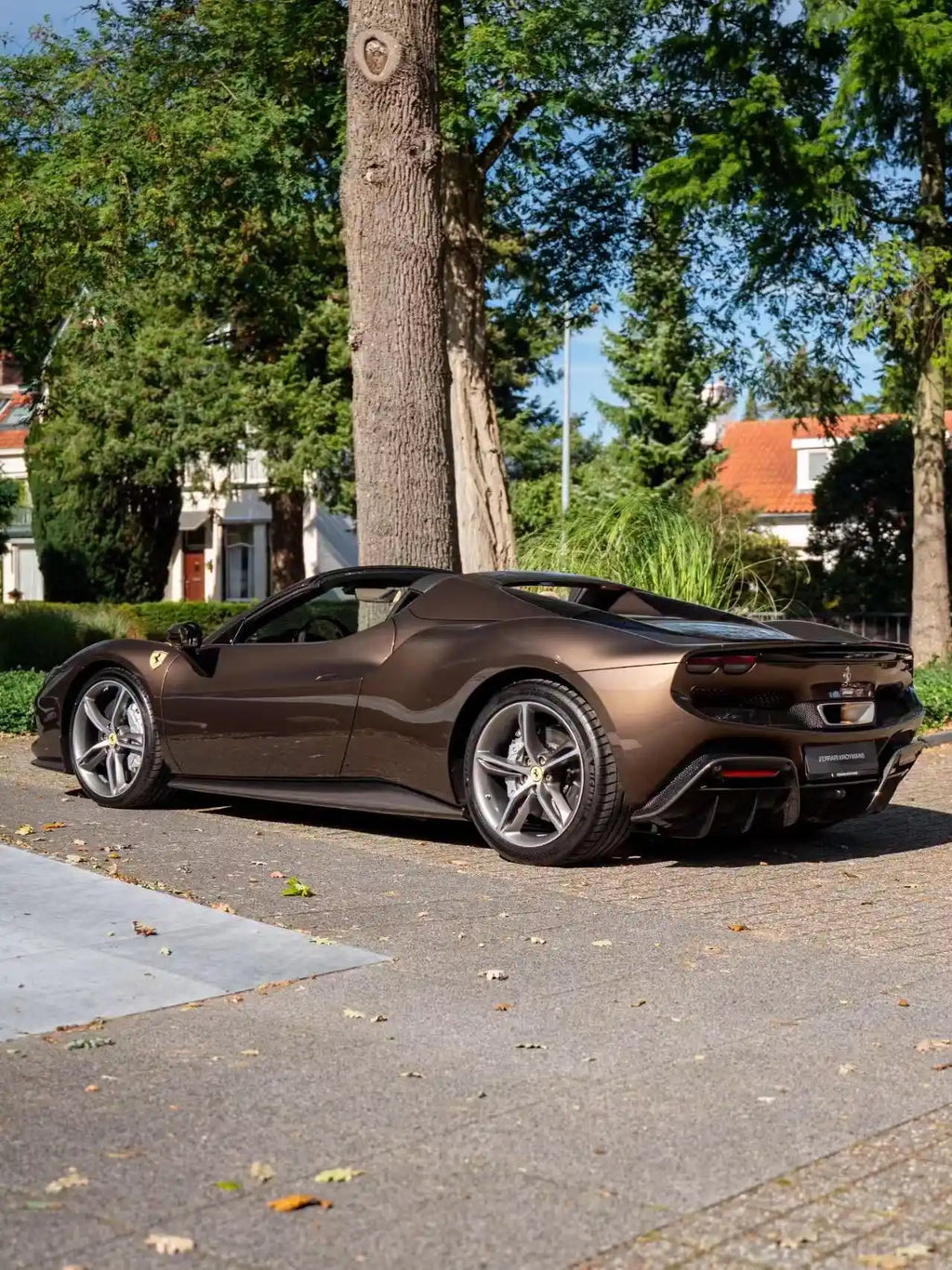 Rear-left view of Mocha Truffle wrapped Ferrari 296 GTS - highlighting rear wing design - Kaleido