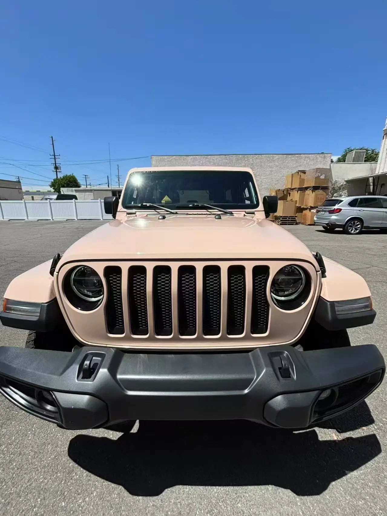 Front view of Jeep Wrangler in Gloss Milktea warm beige vinyl wrap - Kaleido