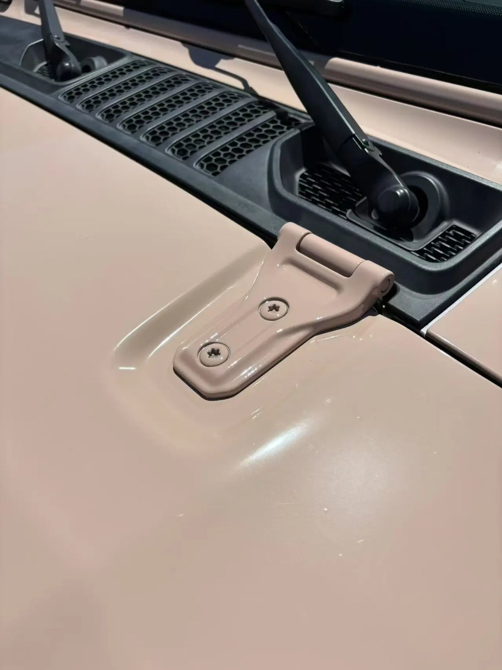 Macro detail of Gloss Milktea vinyl on Jeep Wrangler hood - creamy beige finish - Kaleido