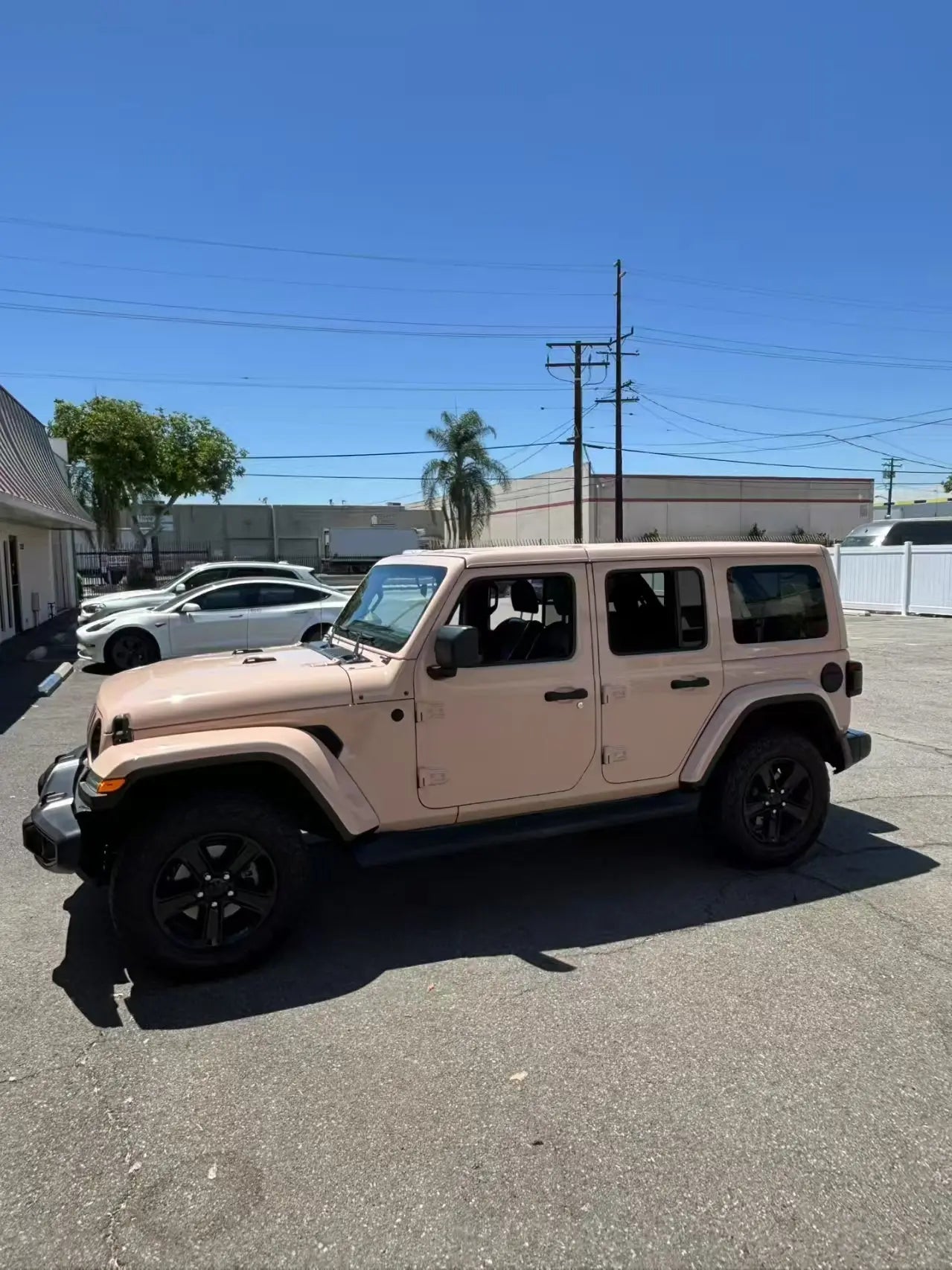 Jeep Wrangler in Gloss Milktea vinyl wrap - left side profile of rugged SUV - Kaleido