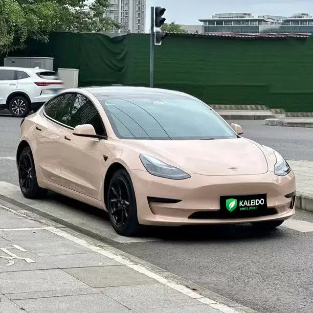 Wide front-right view of Tesla Model 3 with Gloss Milktea high-gloss wrap - Kaleido