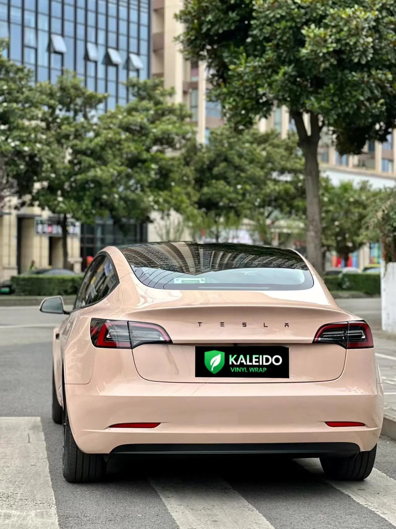 Rear view of Tesla Model 3 wrapped in Gloss Milktea high-gloss beige film - Kaleido