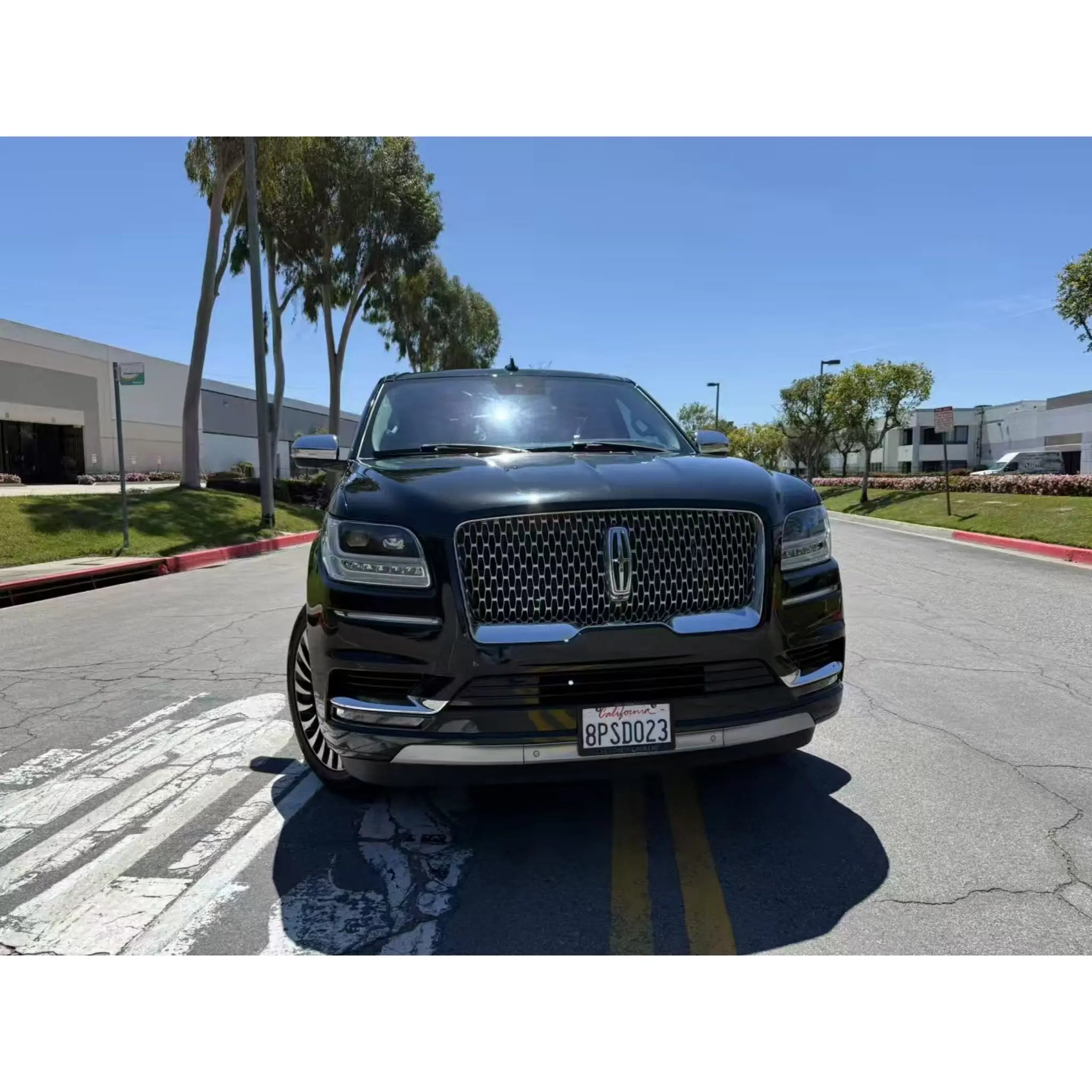 Bold front view of the Lincoln Navigator in Gloss Piano Black - Luxury SUV wrap - Kaleido