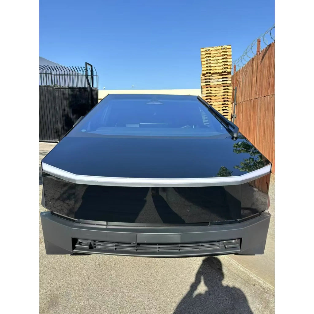 Front view of a Tesla Cybertruck wrapped in Gloss Piano Black - Showcasing the angular body - Kaleido