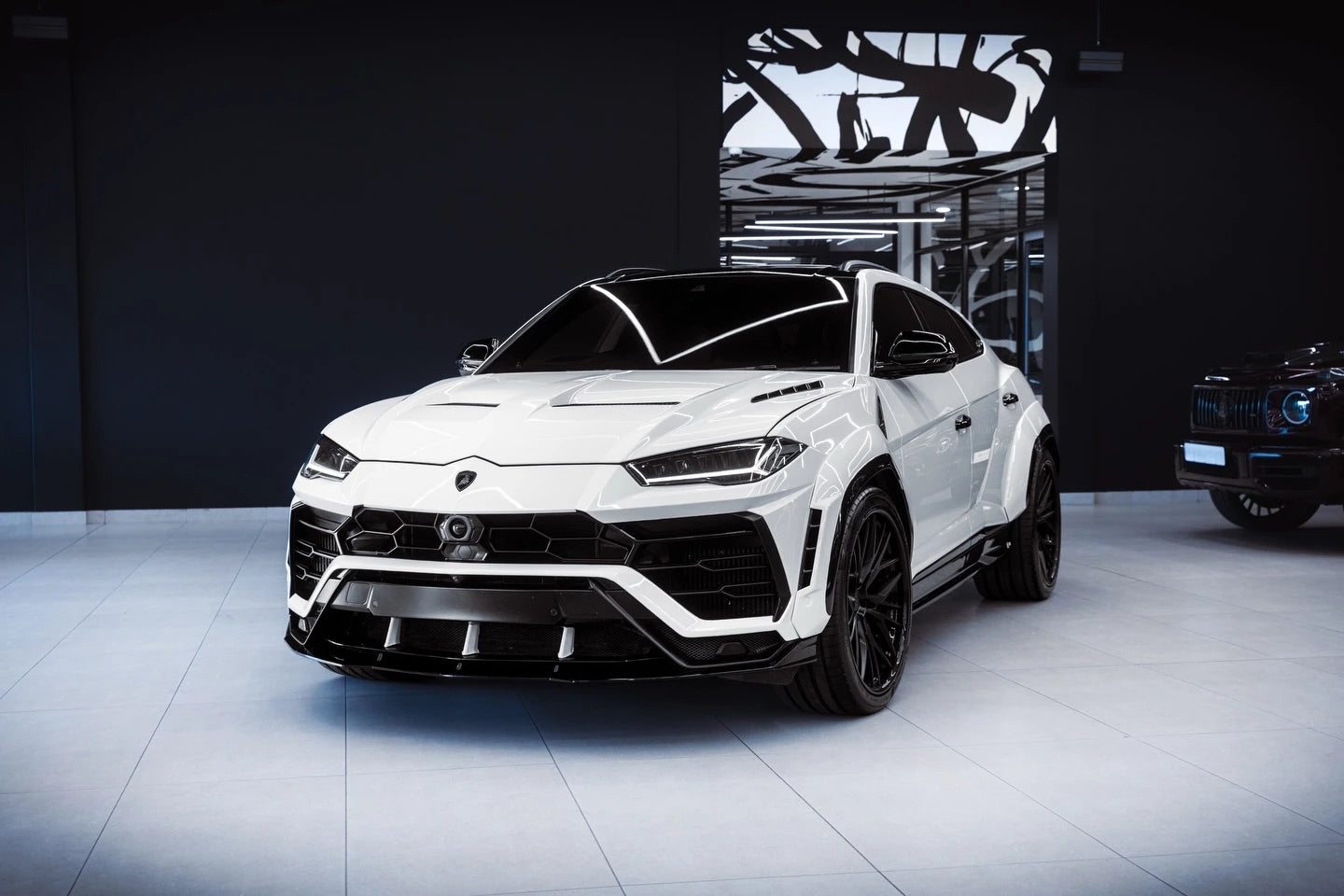 Gloss Piano White vinyl on a Lamborghini Urus - front-left angle - Kaleido