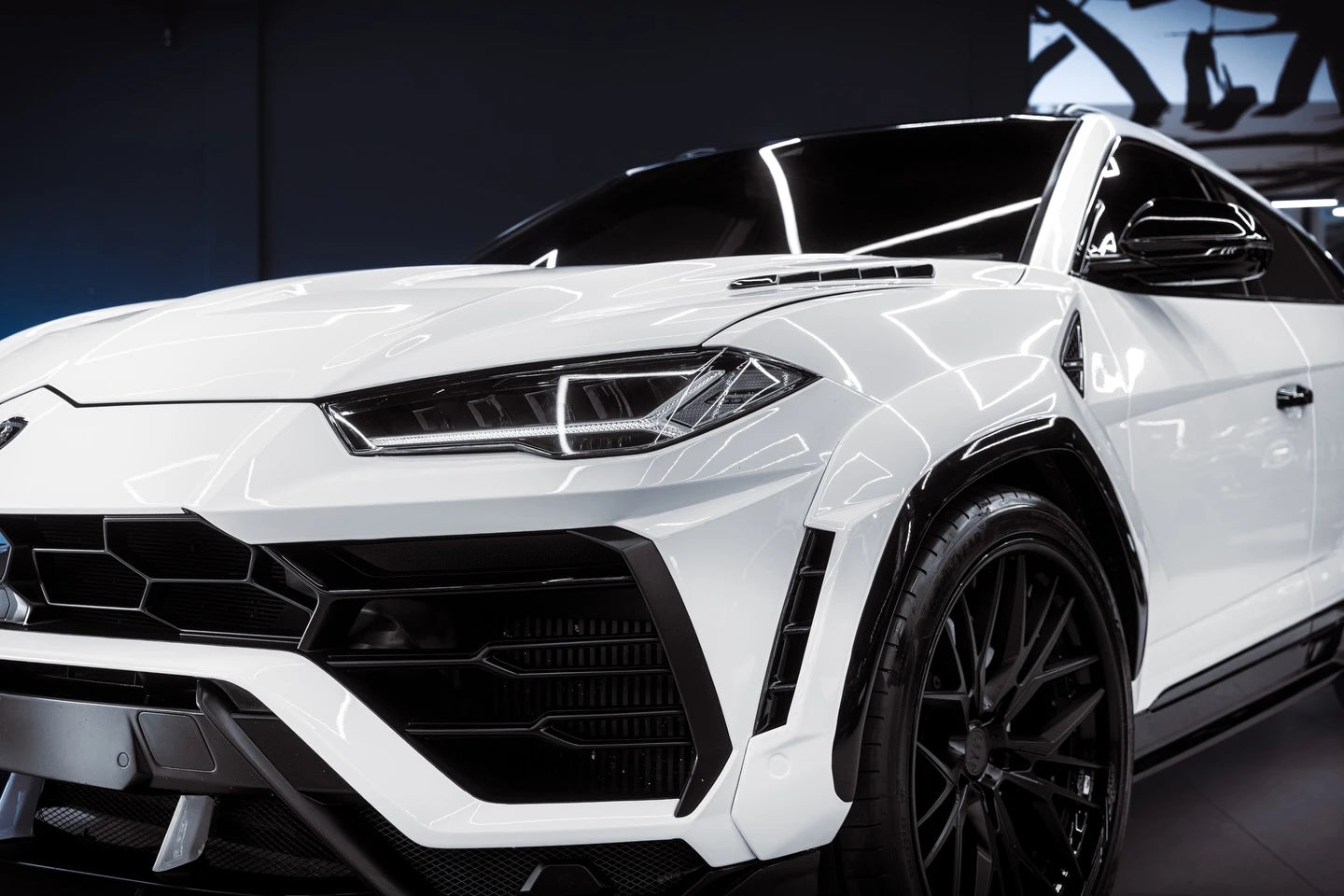 Close-up front-left shot of Gloss Piano White film on a Lamborghini Urus - Kaleido