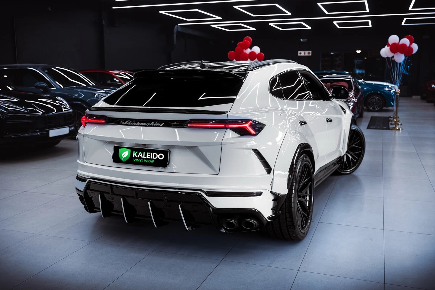 Lamborghini Urus SUV in Gloss Piano White vinyl wrap - rear-right view - Kaleido
