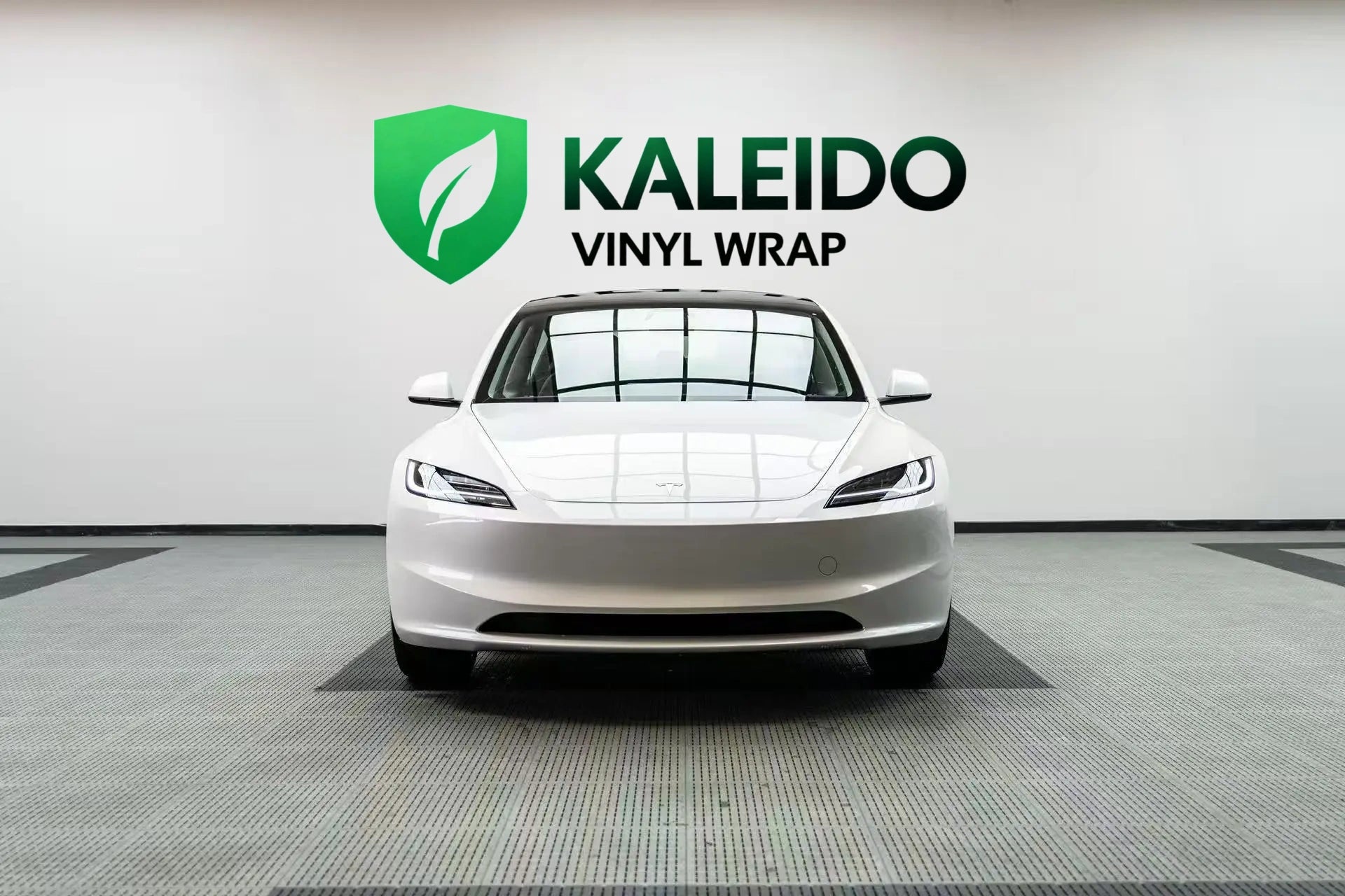 Front view of a Tesla Model 3 wrapped in Gloss Piano White - Kaleido