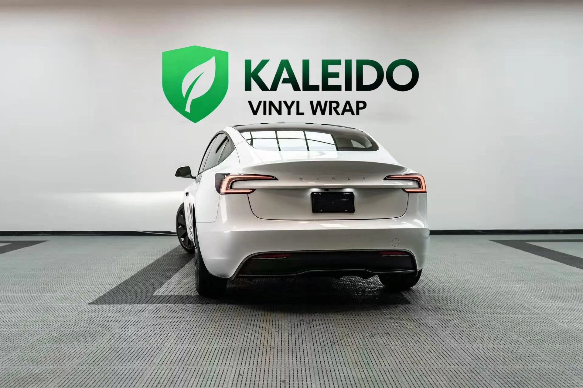 Gloss Piano White wrap on a Tesla Model 3 - rear-left view - Kaleido
