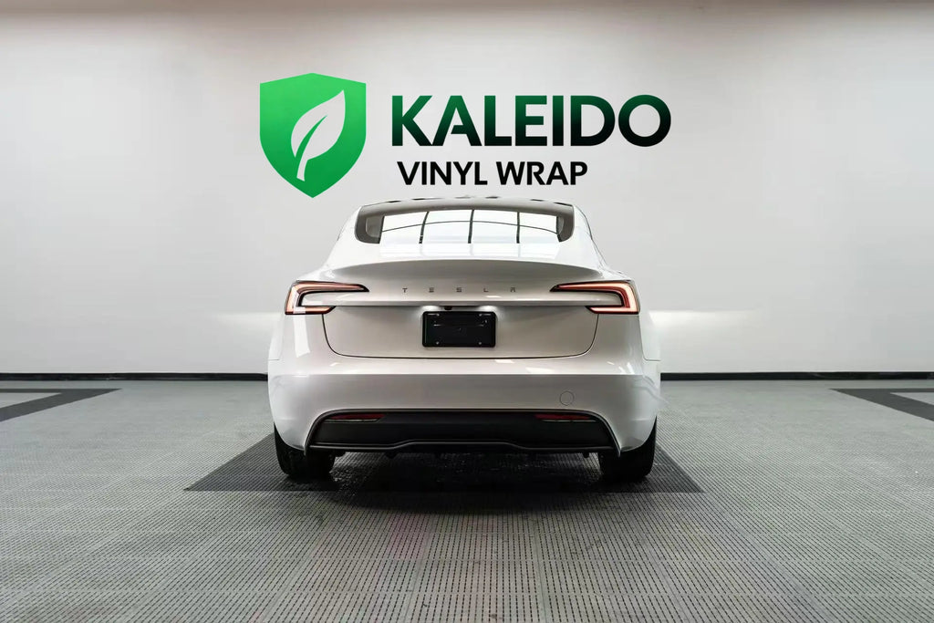 Rear view of a Tesla Model 3 in Gloss Piano White vinyl wrap - Kaleido