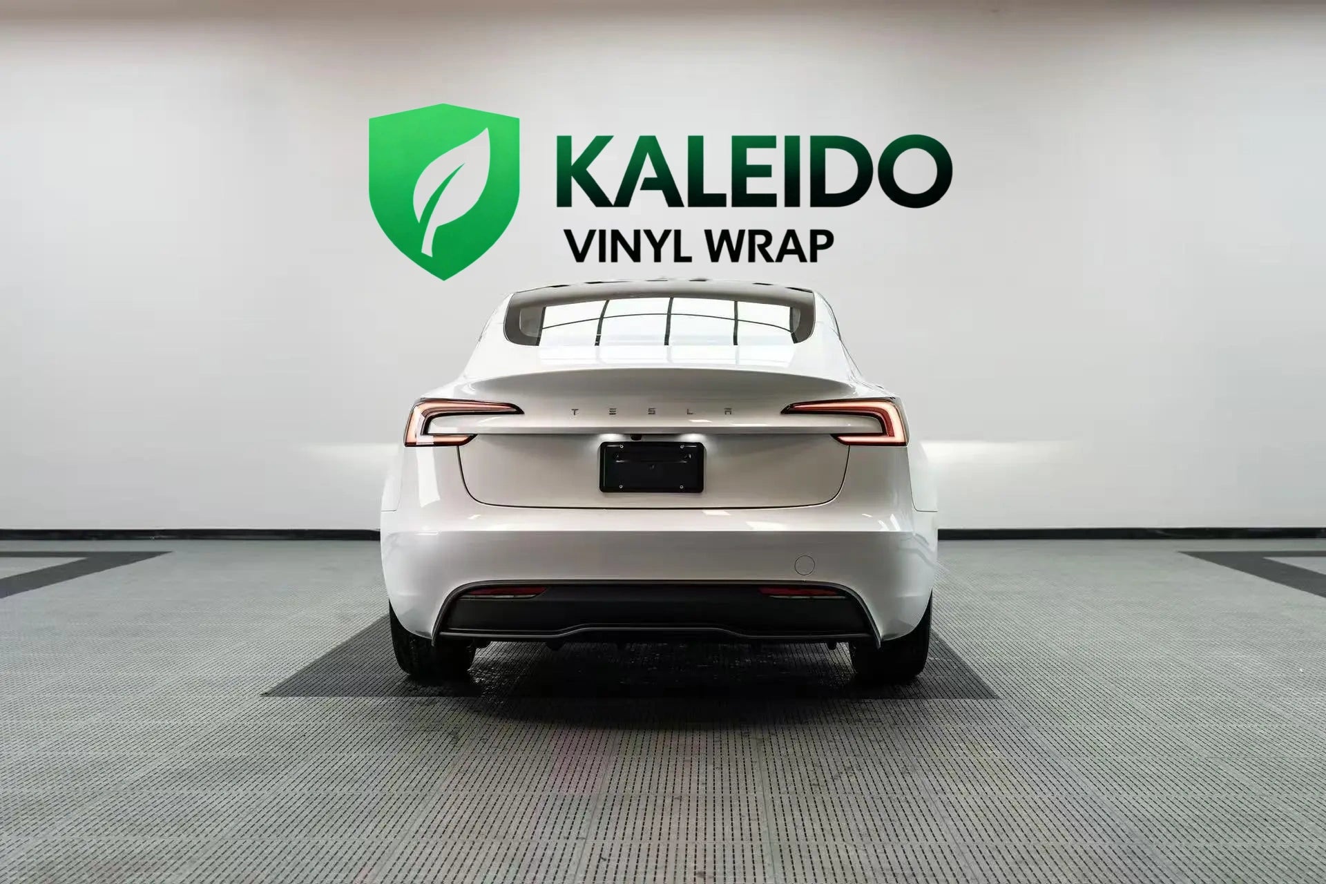 Rear view of a Tesla Model 3 in Gloss Piano White vinyl wrap - Kaleido