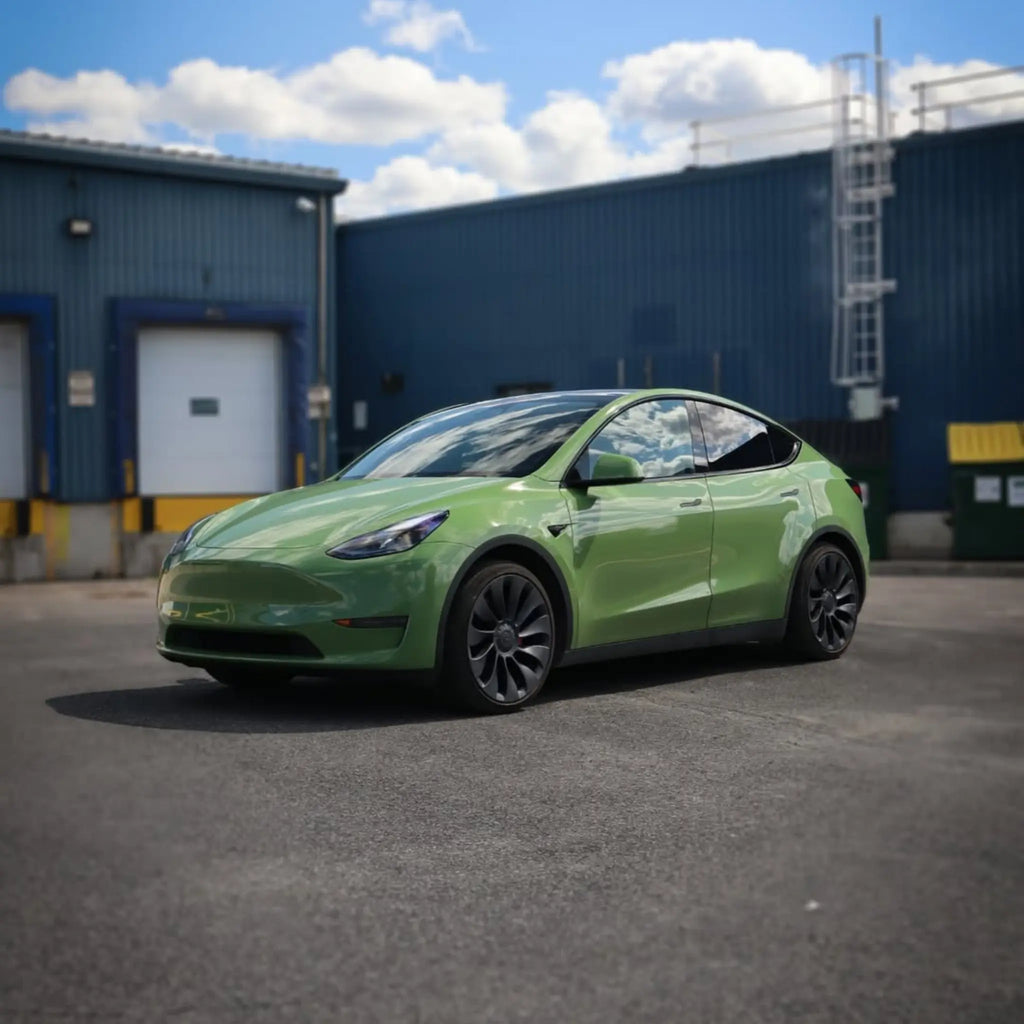 Wide front-left view of Tesla Model Y in Gloss Porsche Olive Green - Kaleido
