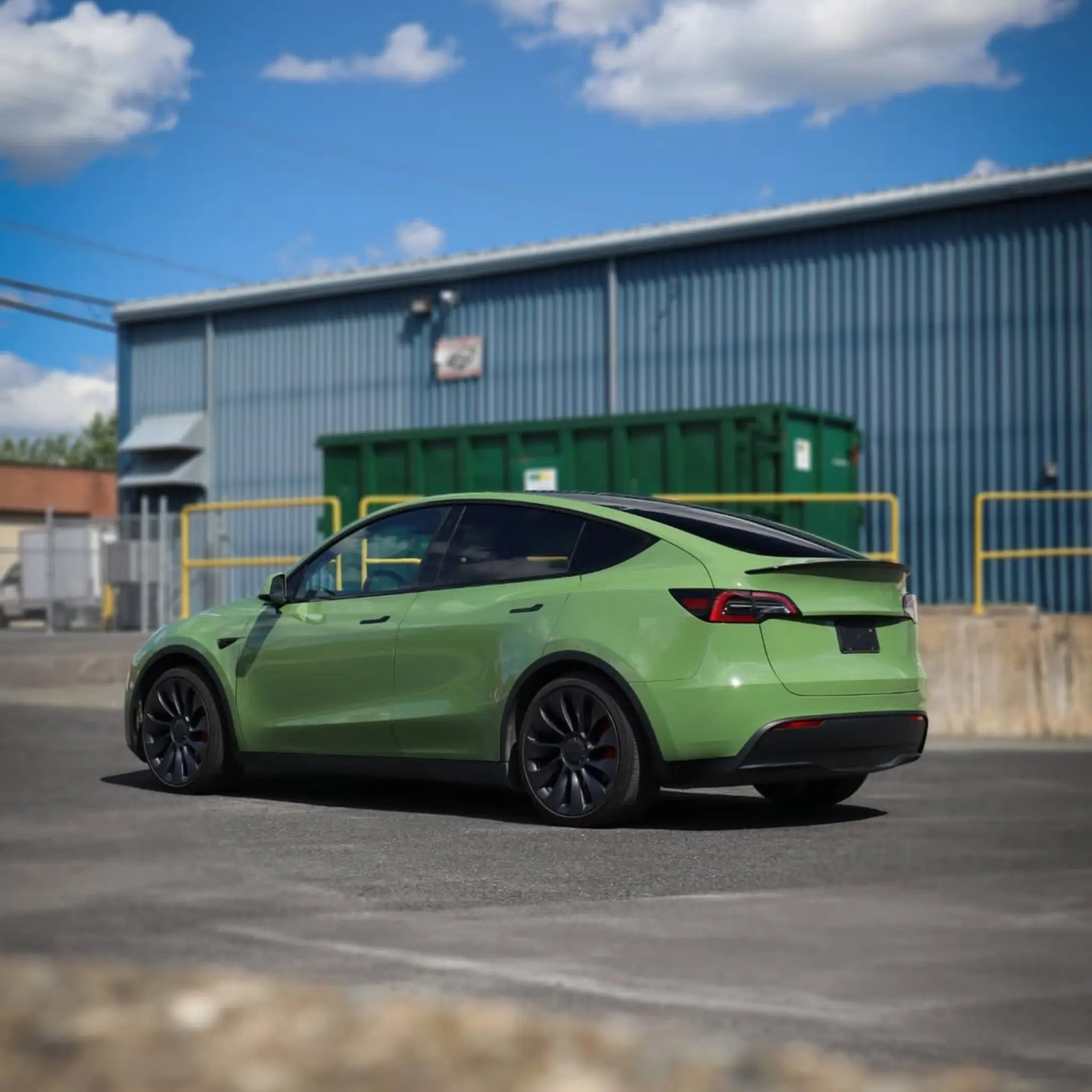 Tesla Model Y with Gloss Porsche Olive Green vinyl - rear-left view - Kaleido