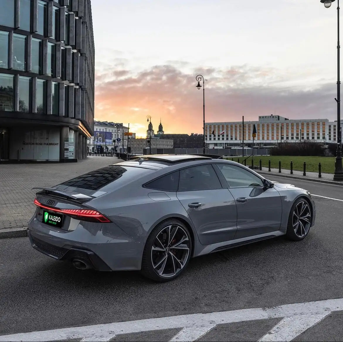 Wide rear-right view of an Audi RS7 Sportback in Gloss RS Nardo Grey Deep vinyl - Kaleido