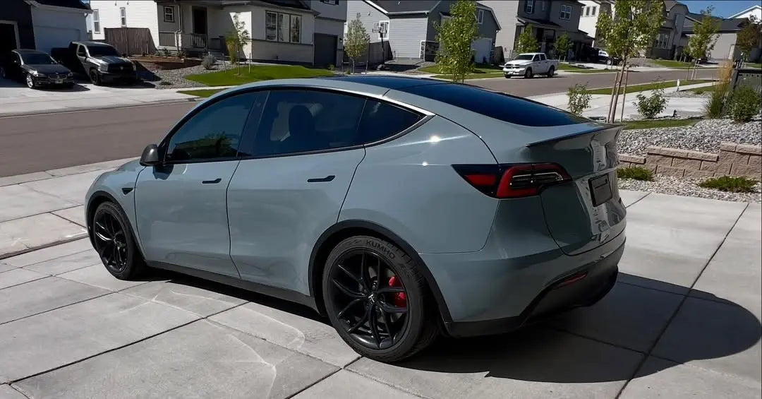 Gloss RS Nardo Grey Deep film on a Tesla Model Y - rear-left view - Kaleido