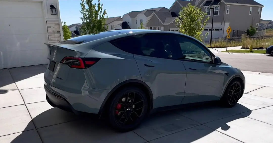 Rear-right view of a Tesla Model Y wrapped in Gloss RS Nardo Grey Deep - Kaleido