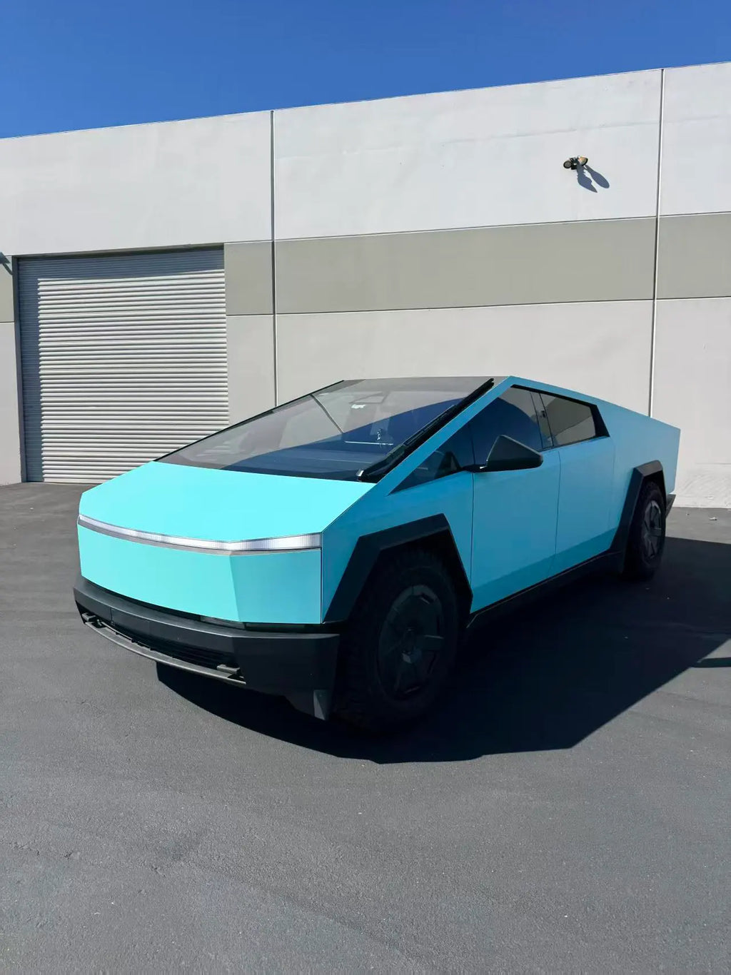 Tesla Cybertruck in Gloss Tiffany wrap - wide front-left view showcasing full front end - Kaleido