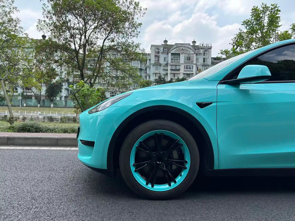 Gloss Tiffany film on Tesla Model Y front-left corner - precise installation showcase - Kaleido