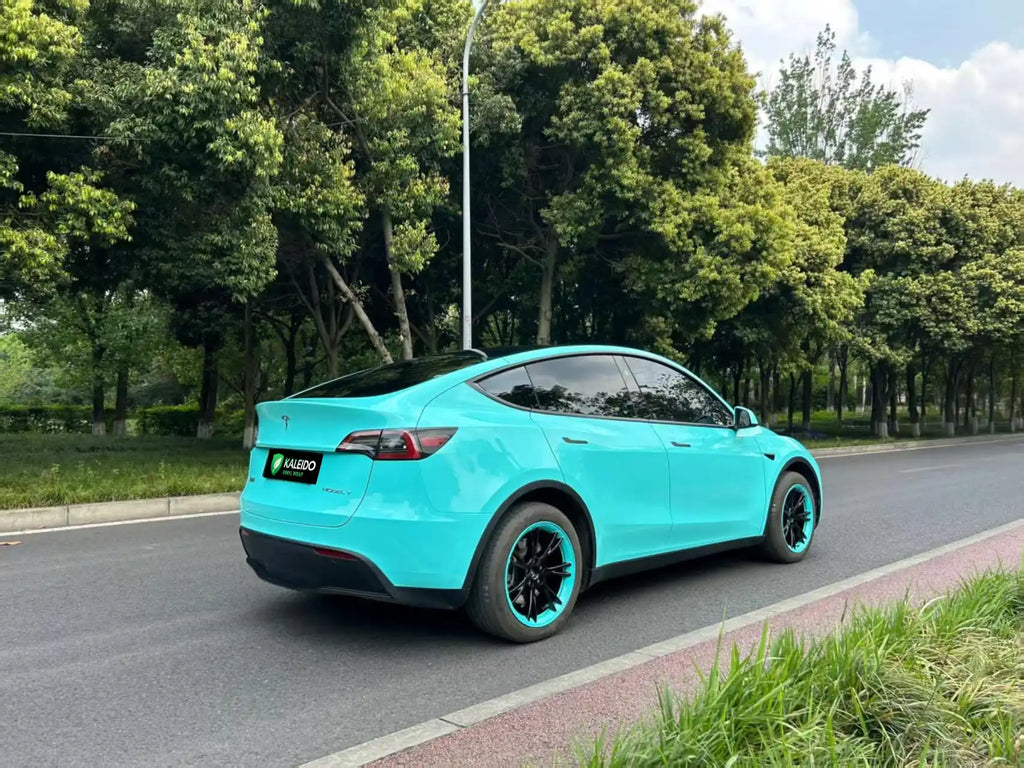 Tesla Model Y with Gloss Tiffany vinyl - rear-right angle view - Kaleido