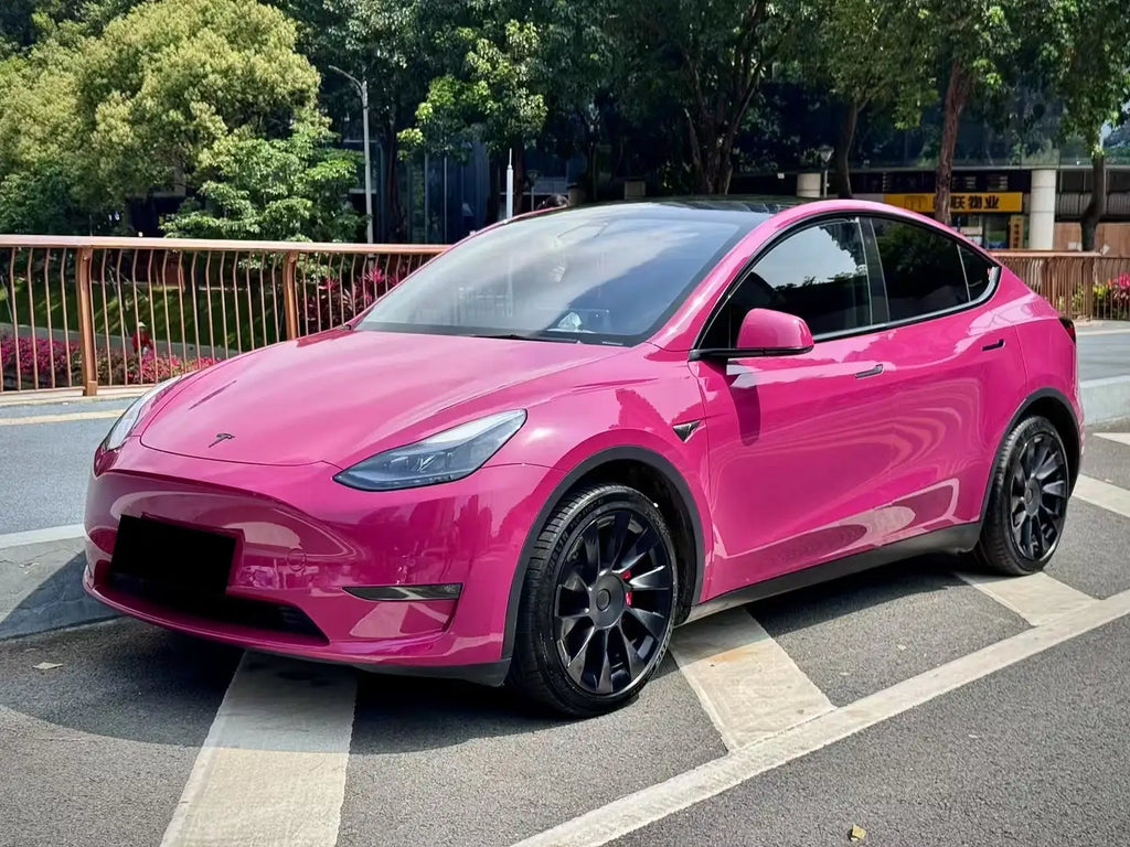 Front-left view of Ruby Night Star wrapped Tesla Model Y - showcasing Porsche OEM red - Kaleido