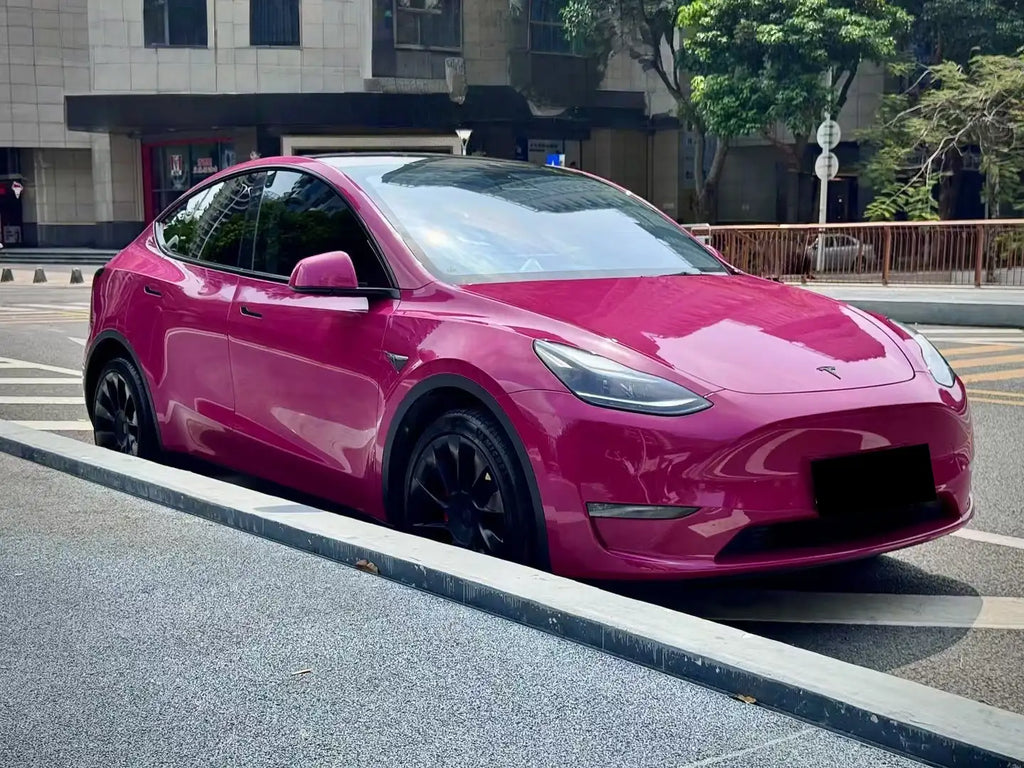Tesla Model Y in Ruby Night Star gloss vinyl - front-right view showing Porsche OEM color match - Kaleido