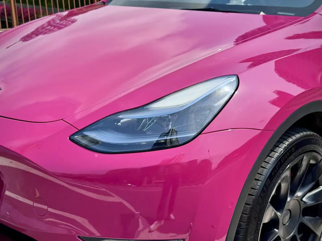 Ruby Night Star gloss vinyl on Tesla Model Y left headlight area - seamless edge work - Kaleido