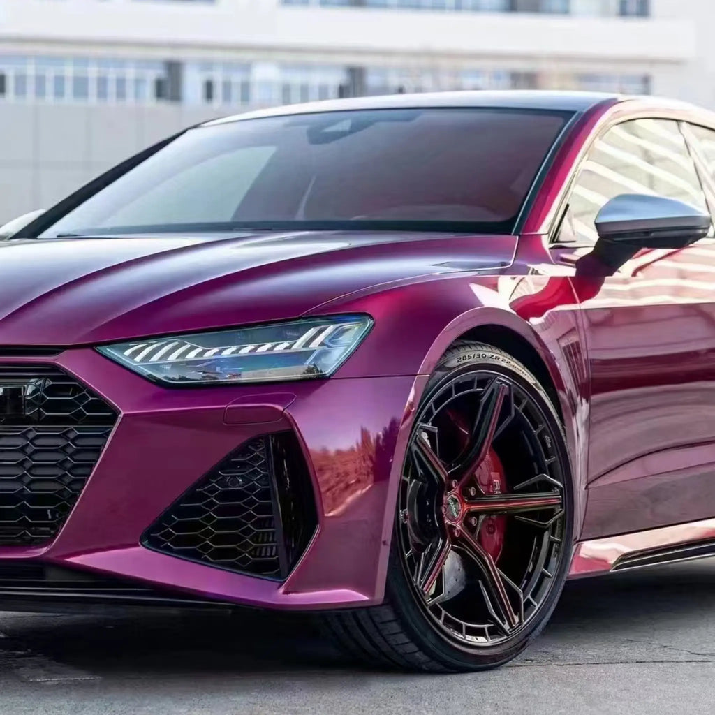 Close-up front-left detail of Glossy Metallic Rubellite Purple film on Audi RS7 Sportback - Kaleido