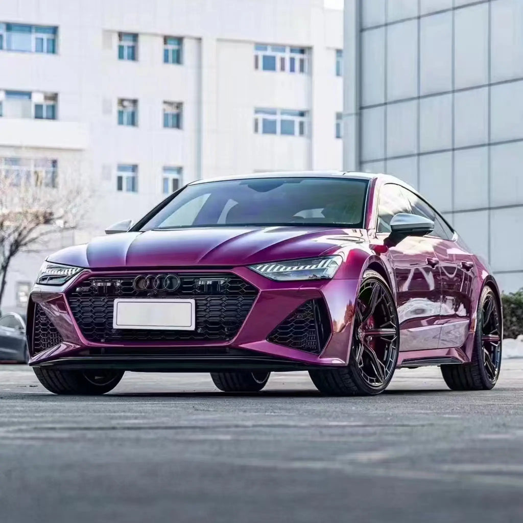 Wide front-left view of Glossy Metallic Rubellite Purple wrapped Audi RS7 Sportback - Kaleido