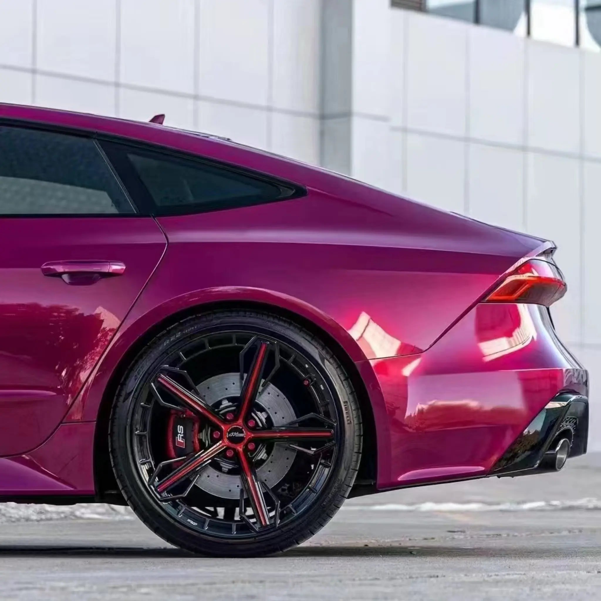 Audi RS7 Sportback in Glossy Metallic Rubellite Purple - rear-left corner detail - Kaleido