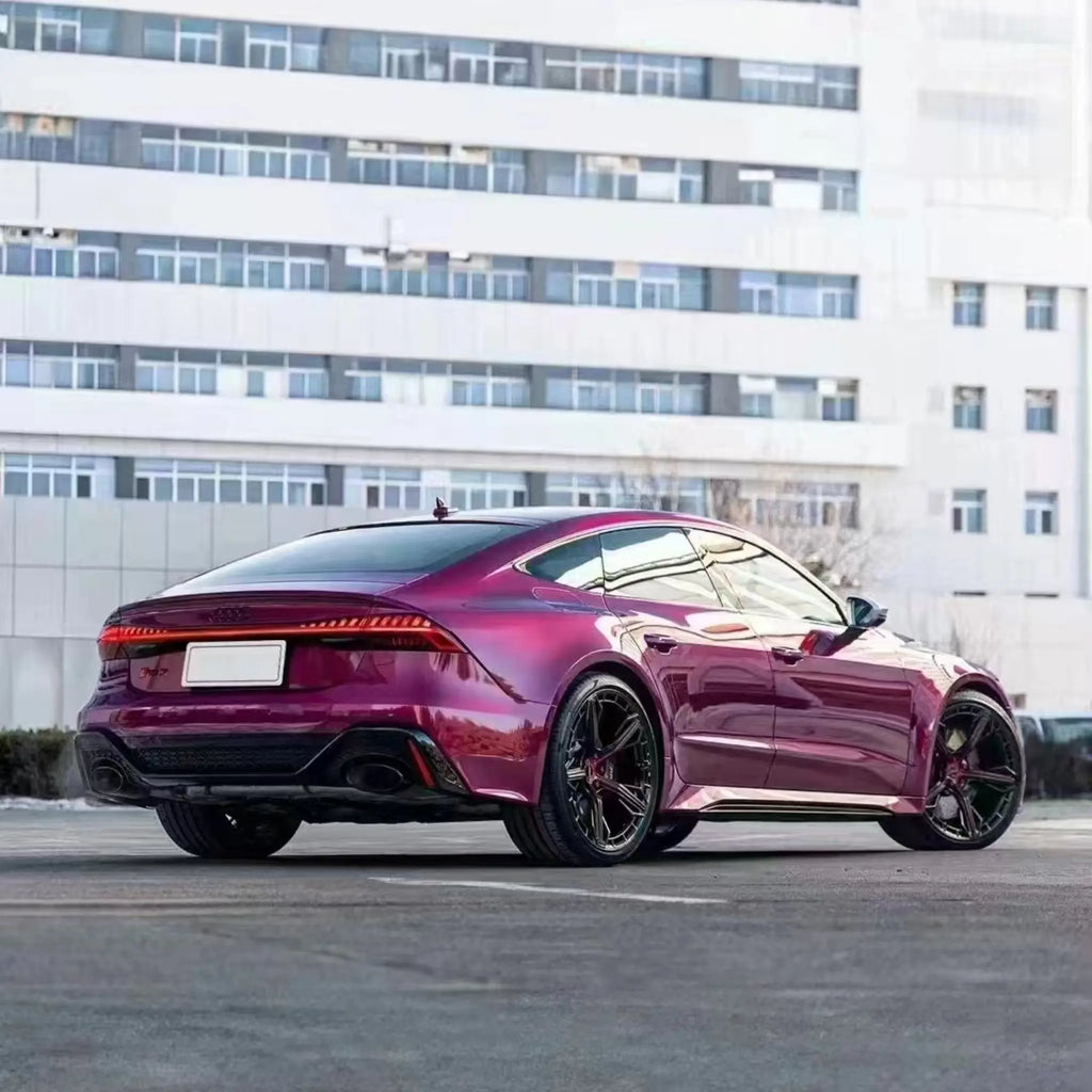 Wide rear-right view of Audi RS7 Sportback (C8) in Glossy Metallic Rubellite Purple wrap - Kaleido