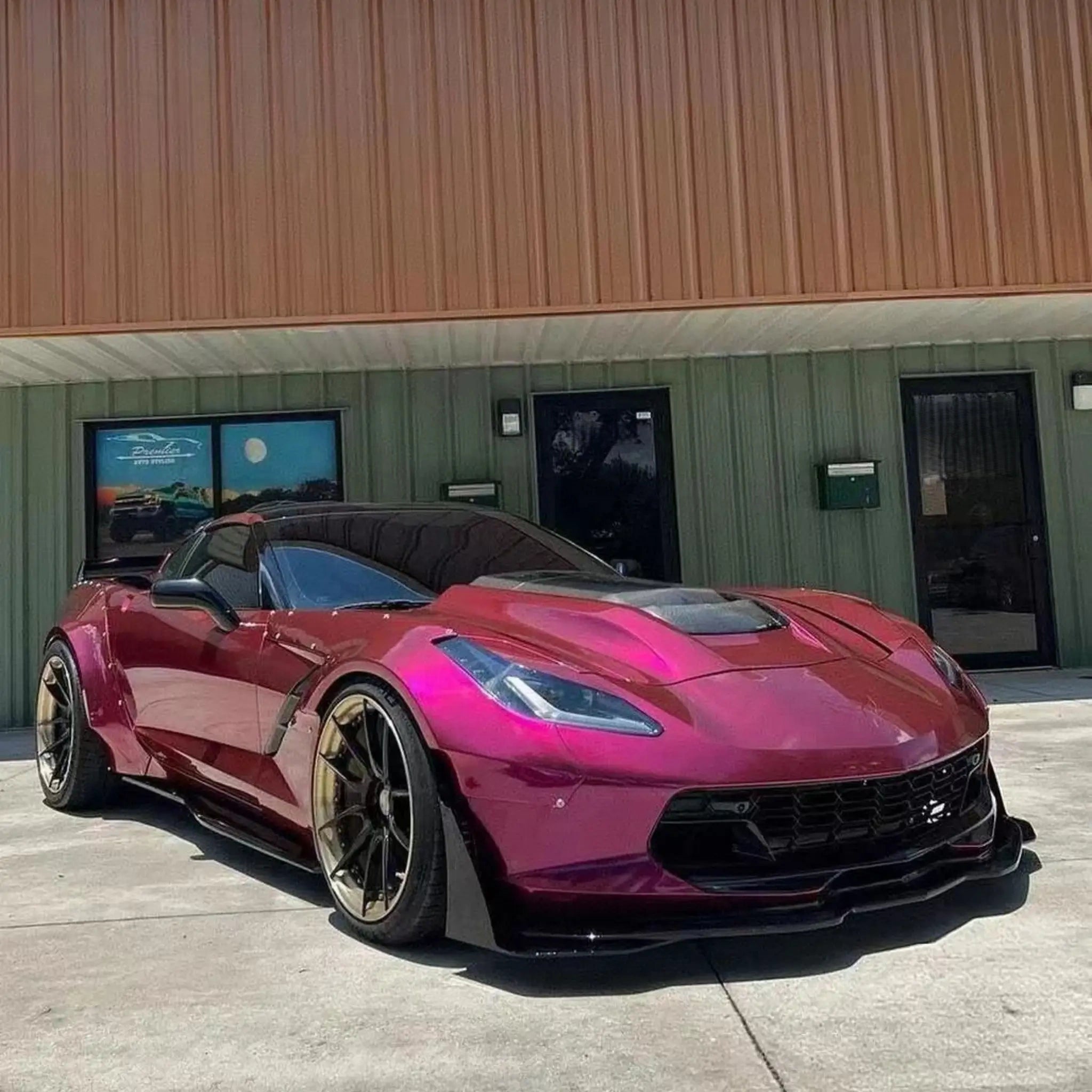 Widebody Chevrolet Corvette C7 in Glossy Metallic Rubellite Purple vinyl - front-right view - Kaleido