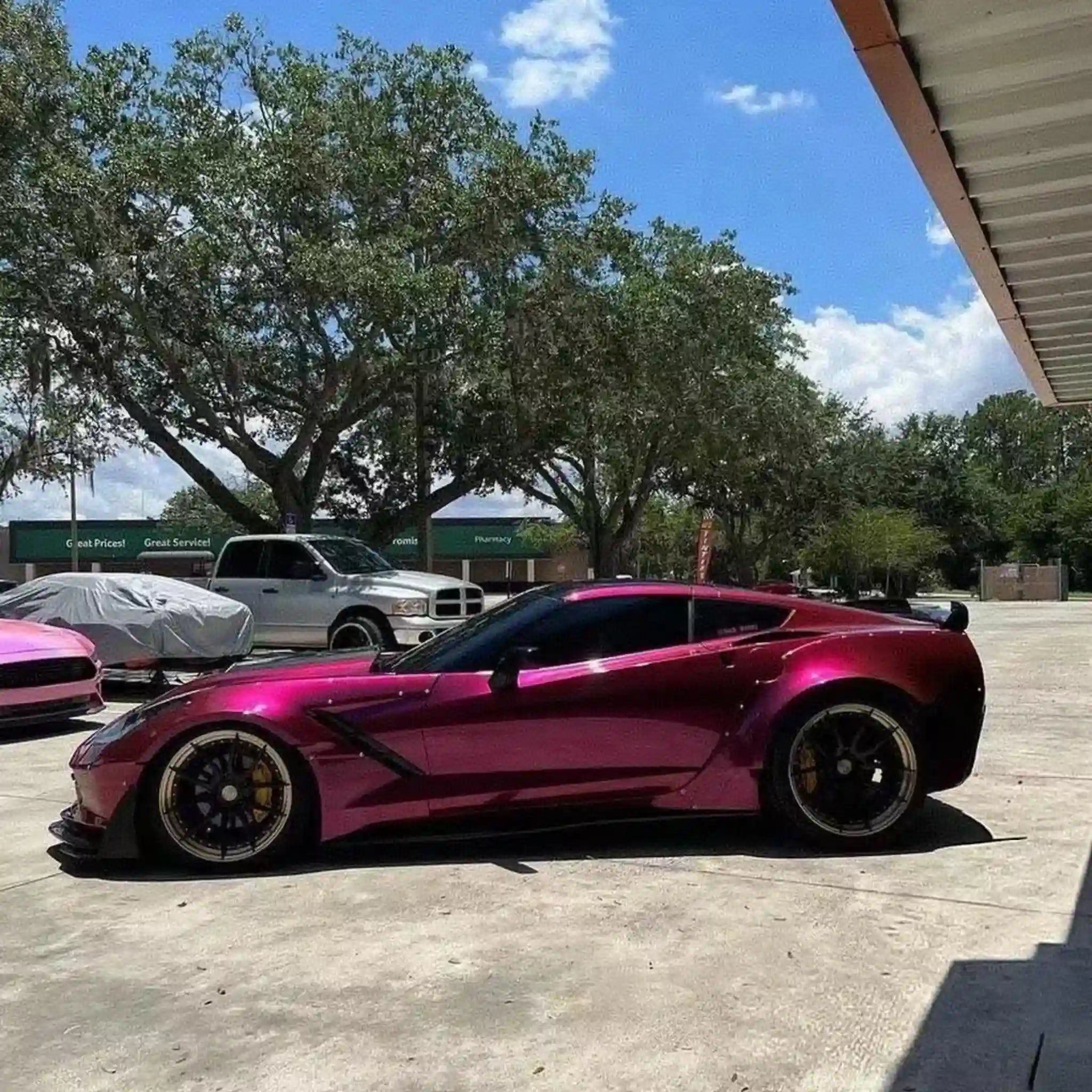 Glossy Metallic Rubellite Purple film on the left side of a widebody Corvette C7 - Kaleido