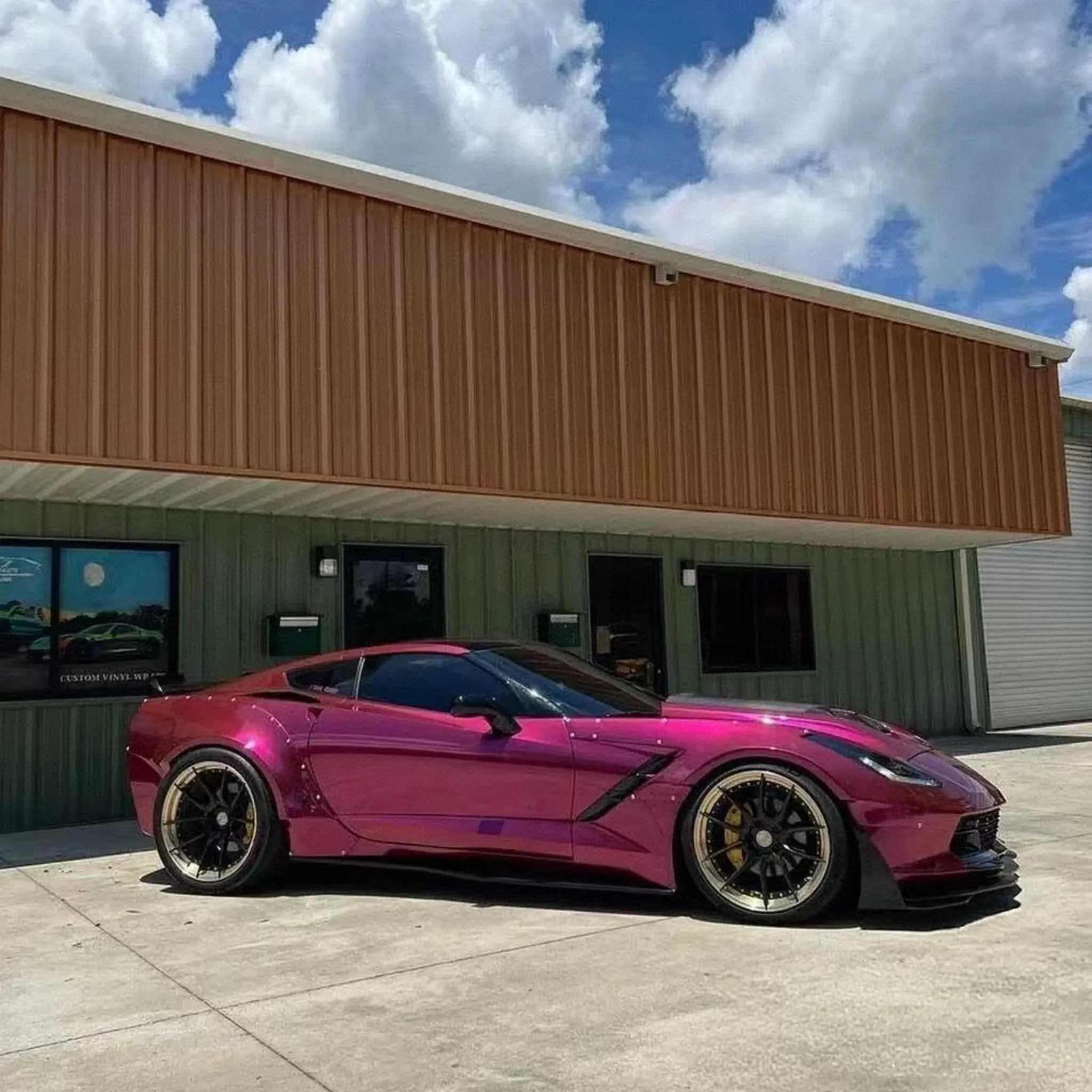 Right side view of a Glossy Metallic Rubellite Purple wrapped widebody Chevrolet Corvette C7 - Kaleido