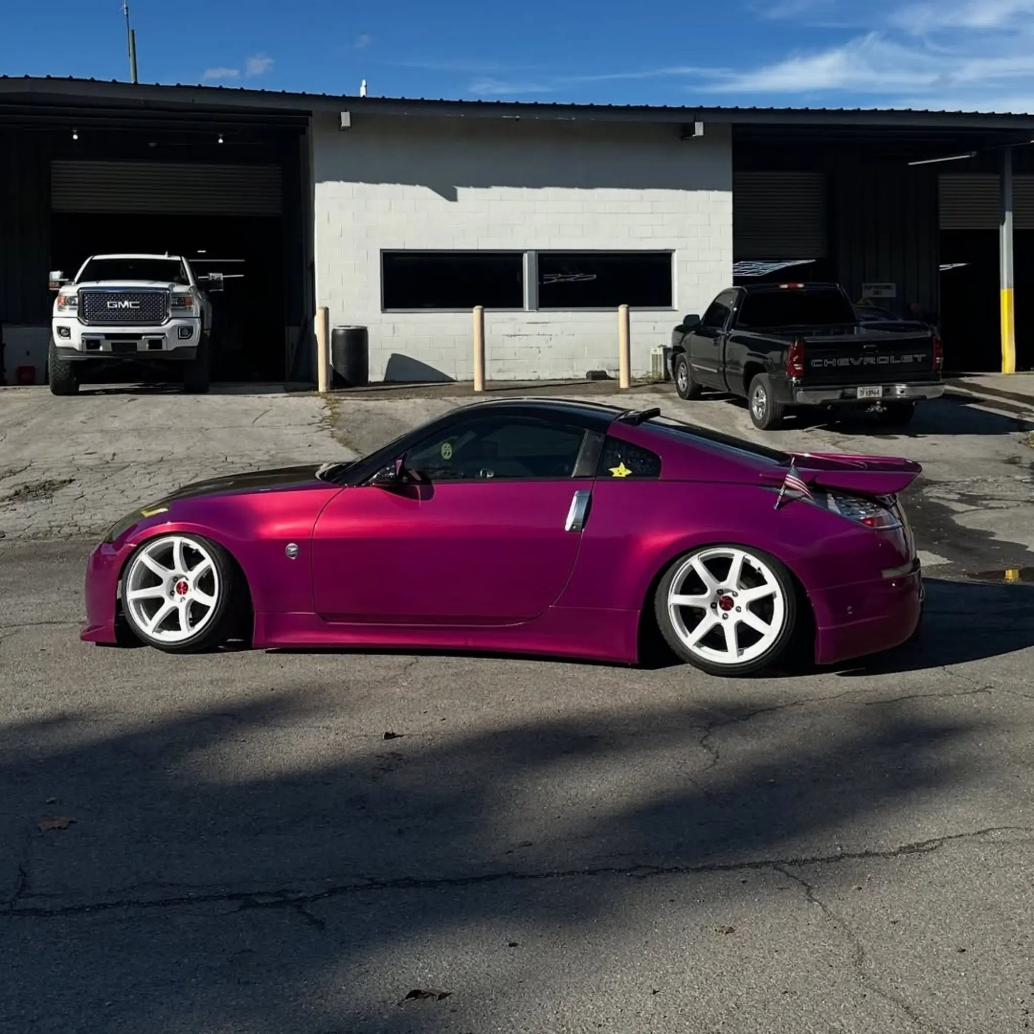 Side profile of a Glossy Metallic Rubellite Purple wrapped Nissan Silvia S15 modified car - Kaleido